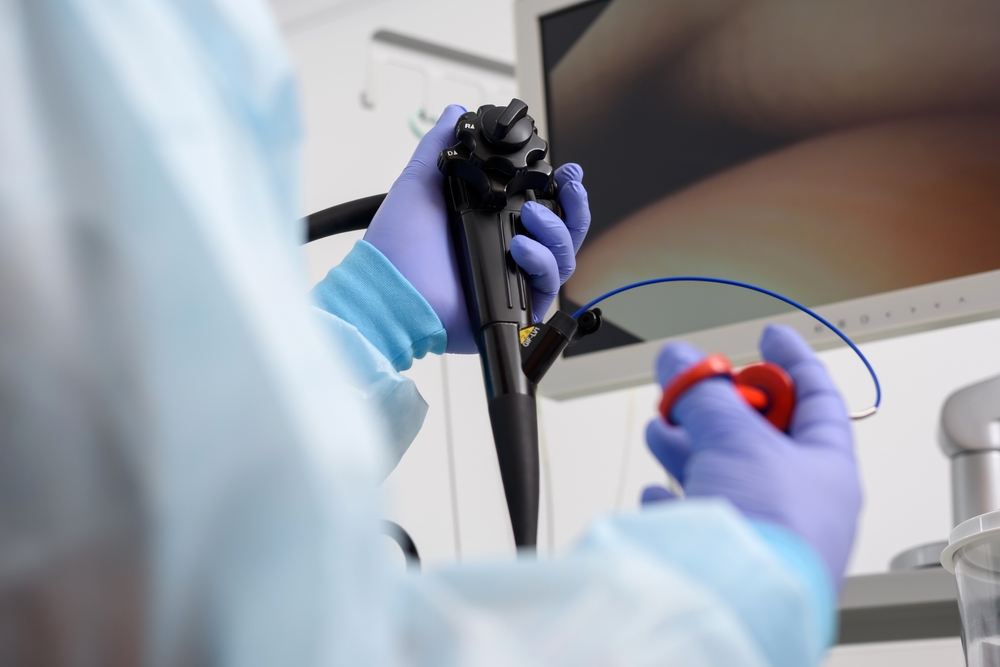 doctor holding colonoscopy camera.