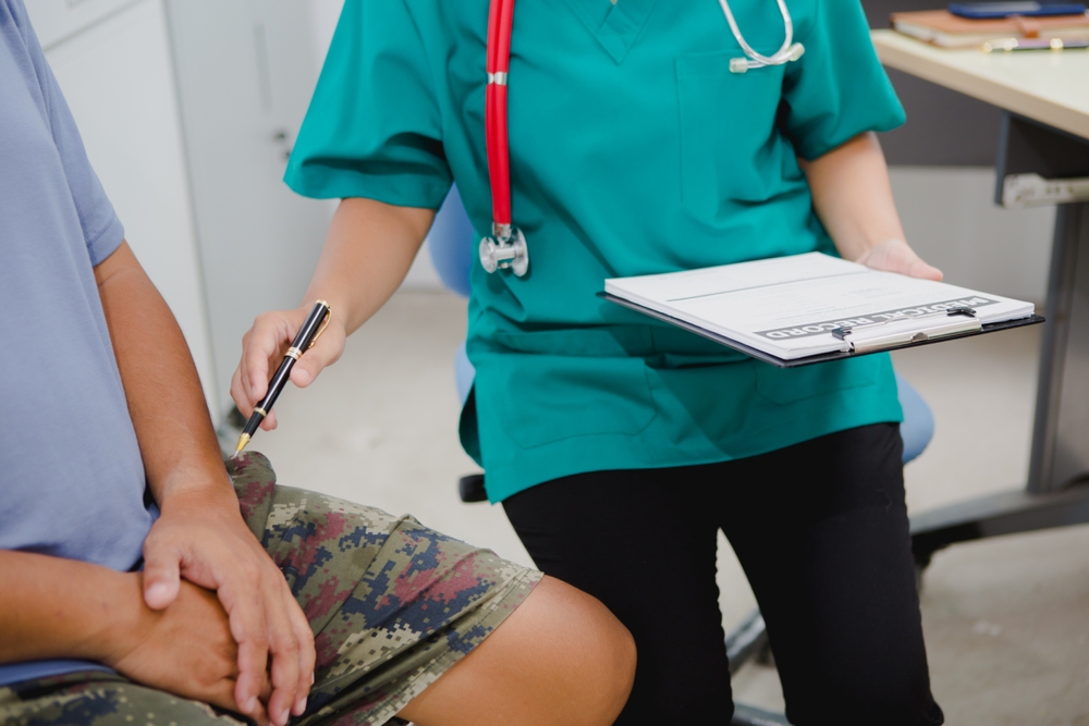 doctor talking with patient about hernia.
